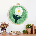 Finished single white daisy artwork displayed on a wall