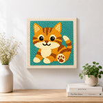 Finished sitting orange tabby cat artwork displayed on a wall
