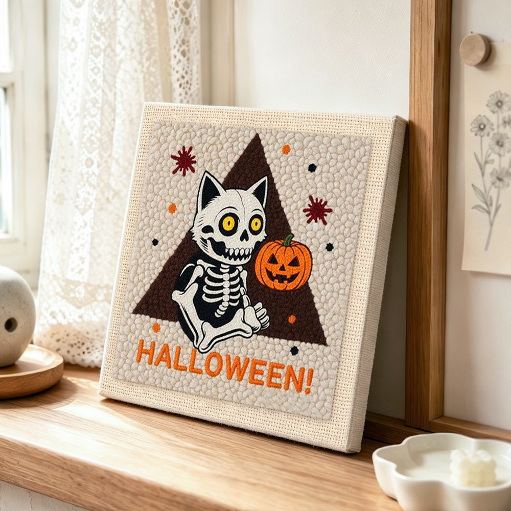 Sitting skeleton cat punch needle artwork displayed on a table
