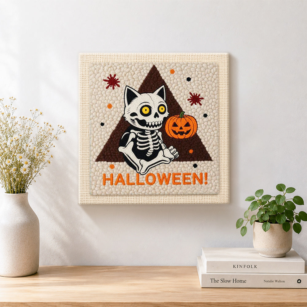 Finished sitting skeleton cat artwork displayed on a wall