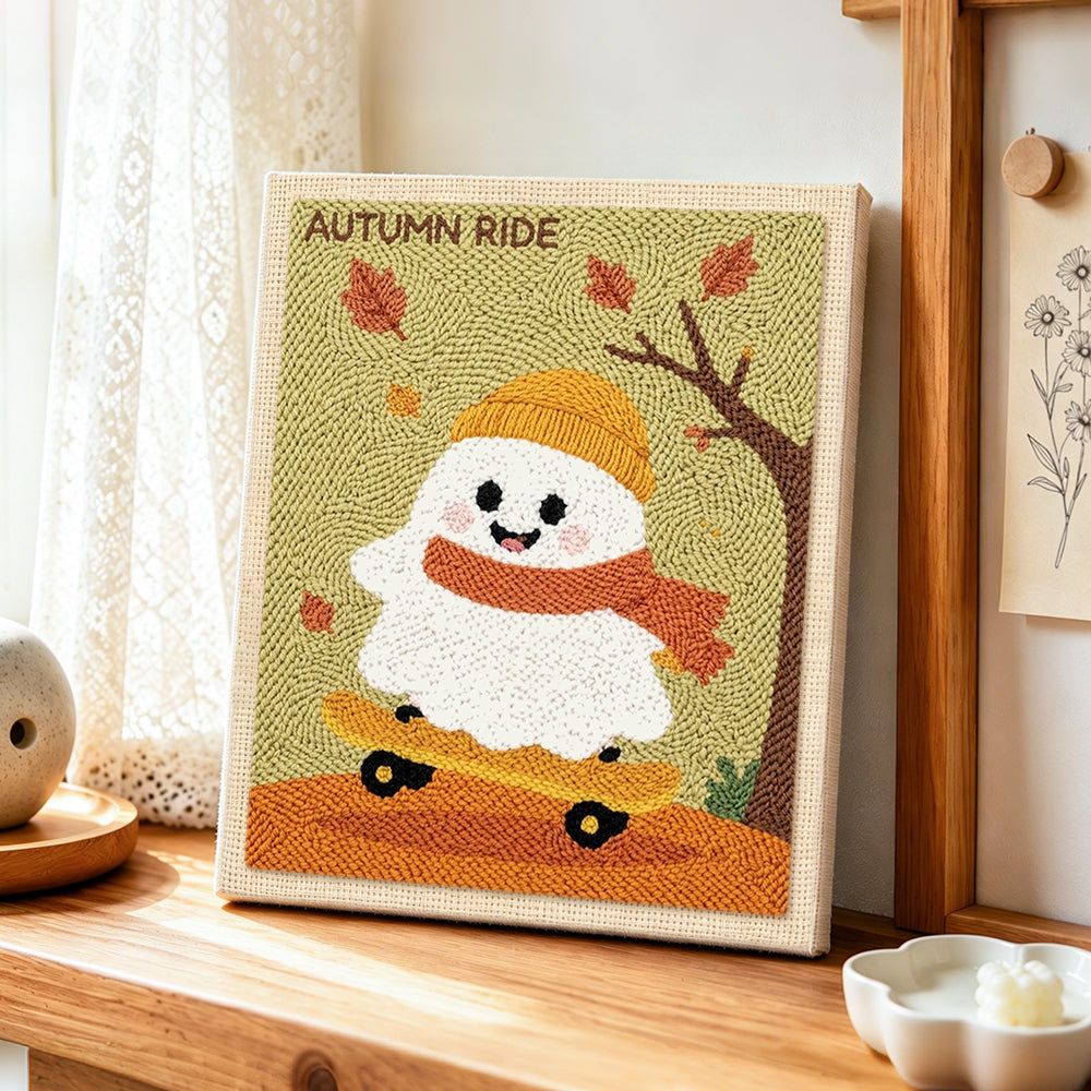 Skateboarding autumn ghost punch needle artwork displayed on a table