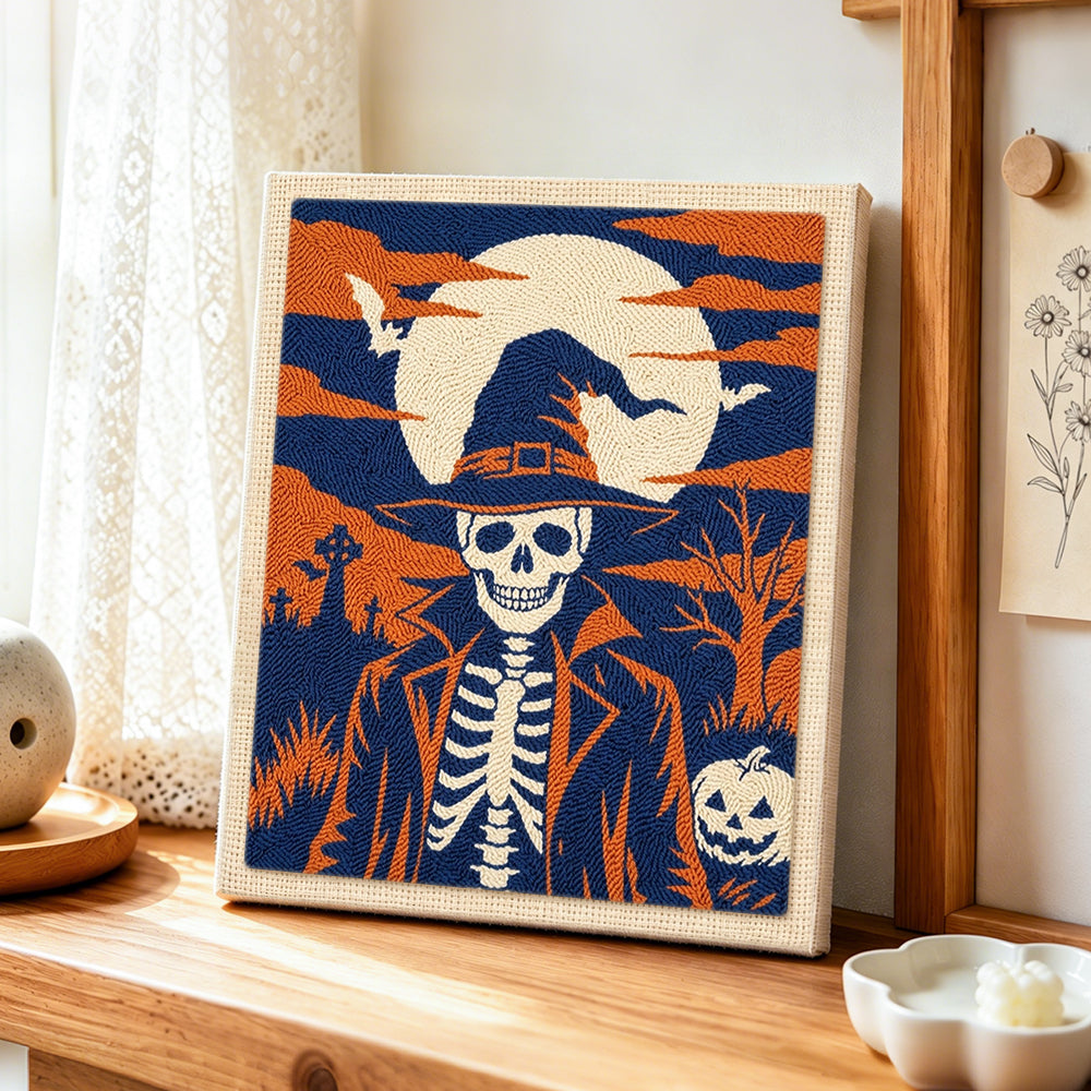 Skeleton gentleman in graveyard punch needle artwork displayed on a table