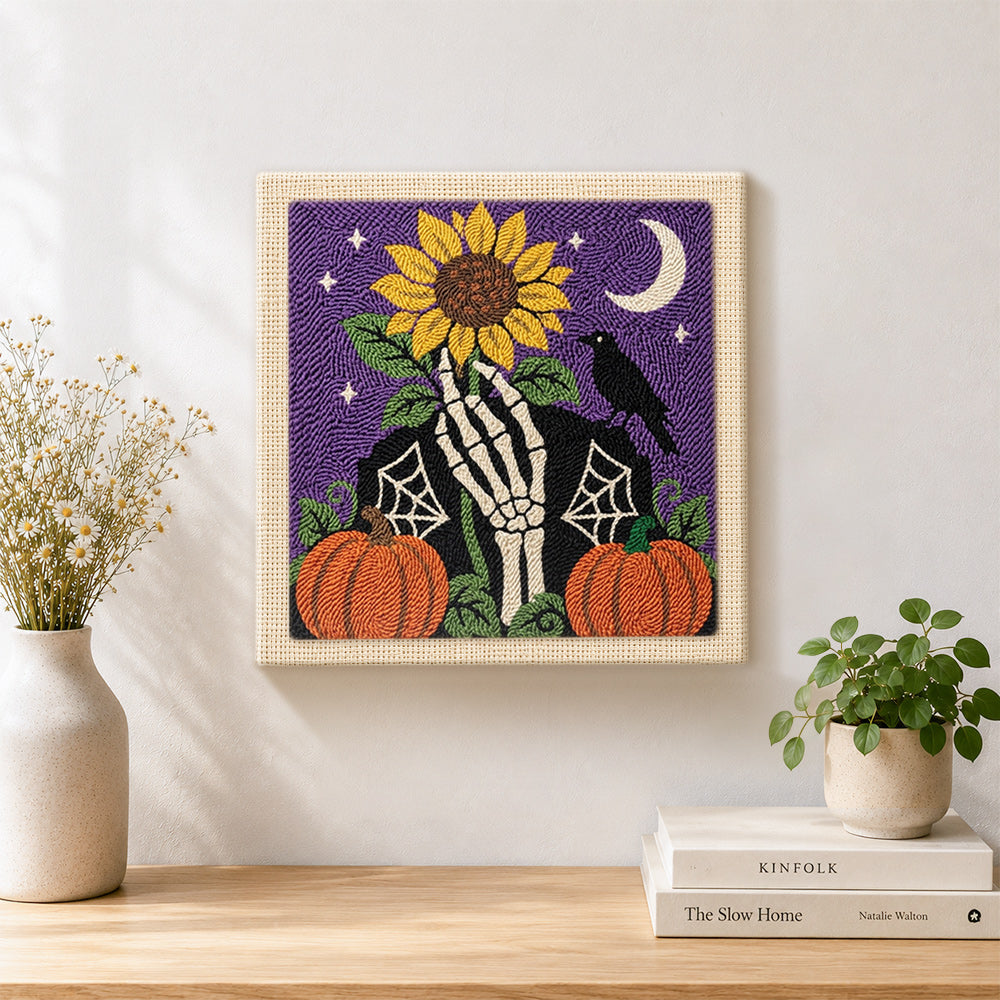 Finished skeleton hand sunflower halloween scene artwork displayed on a wall