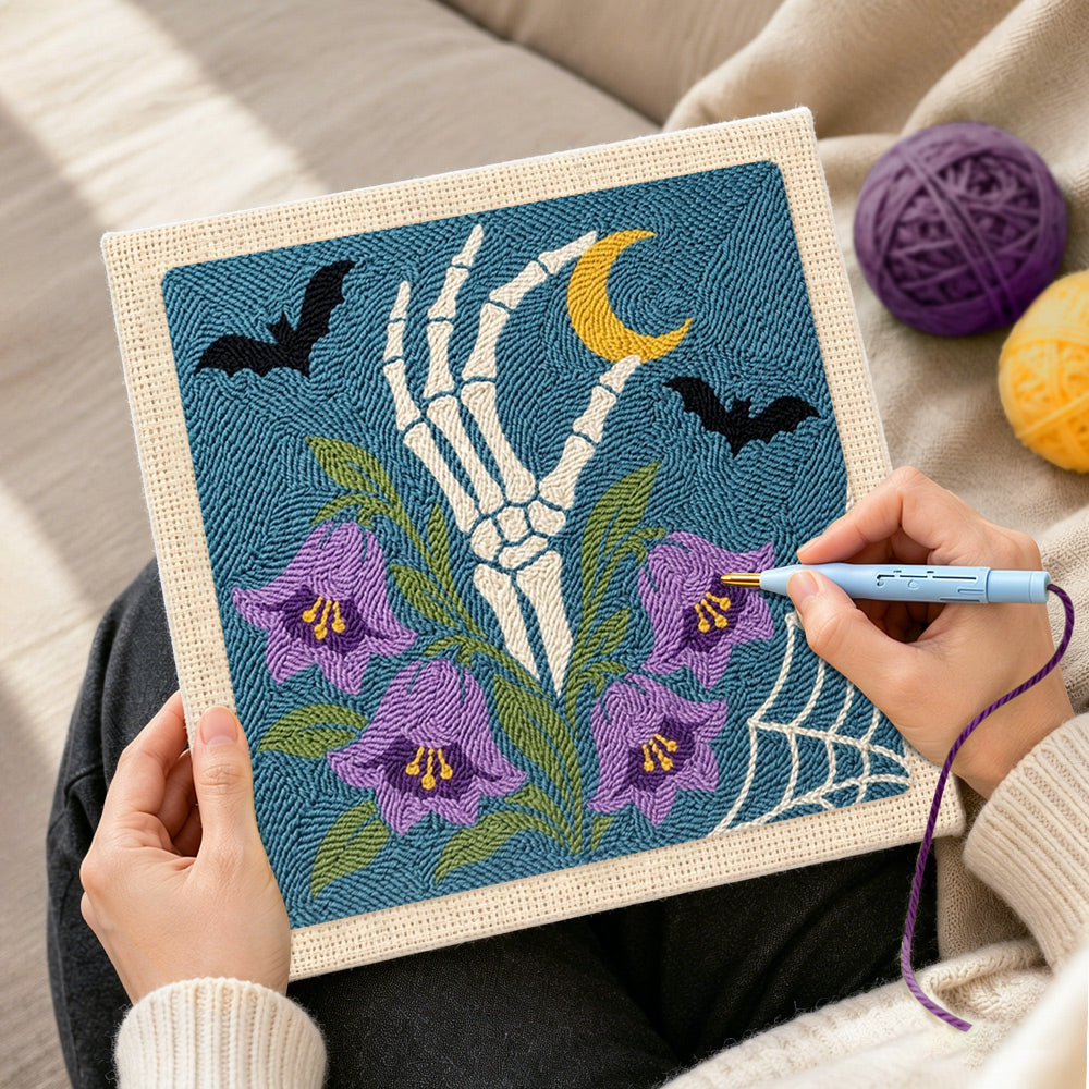 Creating handmade skeleton hand with purple bellflowers punch needle artwork