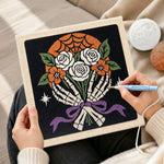 Creating handmade skeleton hands holding roses punch needle artwork