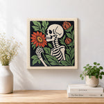 Finished skeleton holding blooms artwork displayed on a wall