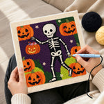 Creating handmade skeleton pumpkin walk punch needle artwork
