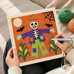 Creating handmade skeleton scarecrow punch needle artwork