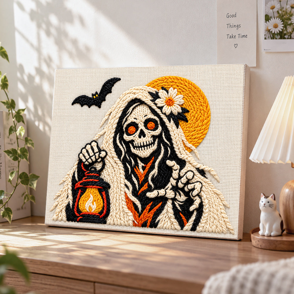 Skeleton spirit holding lantern punch needle artwork displayed on a table
