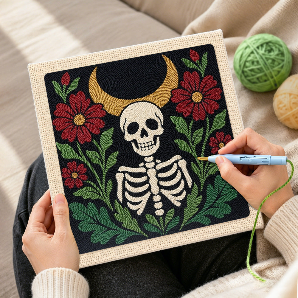 Creating handmade skeleton surrounded by red blooms punch needle artwork