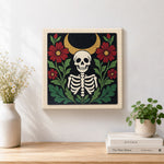 Finished skeleton surrounded by red blooms artwork displayed on a wall