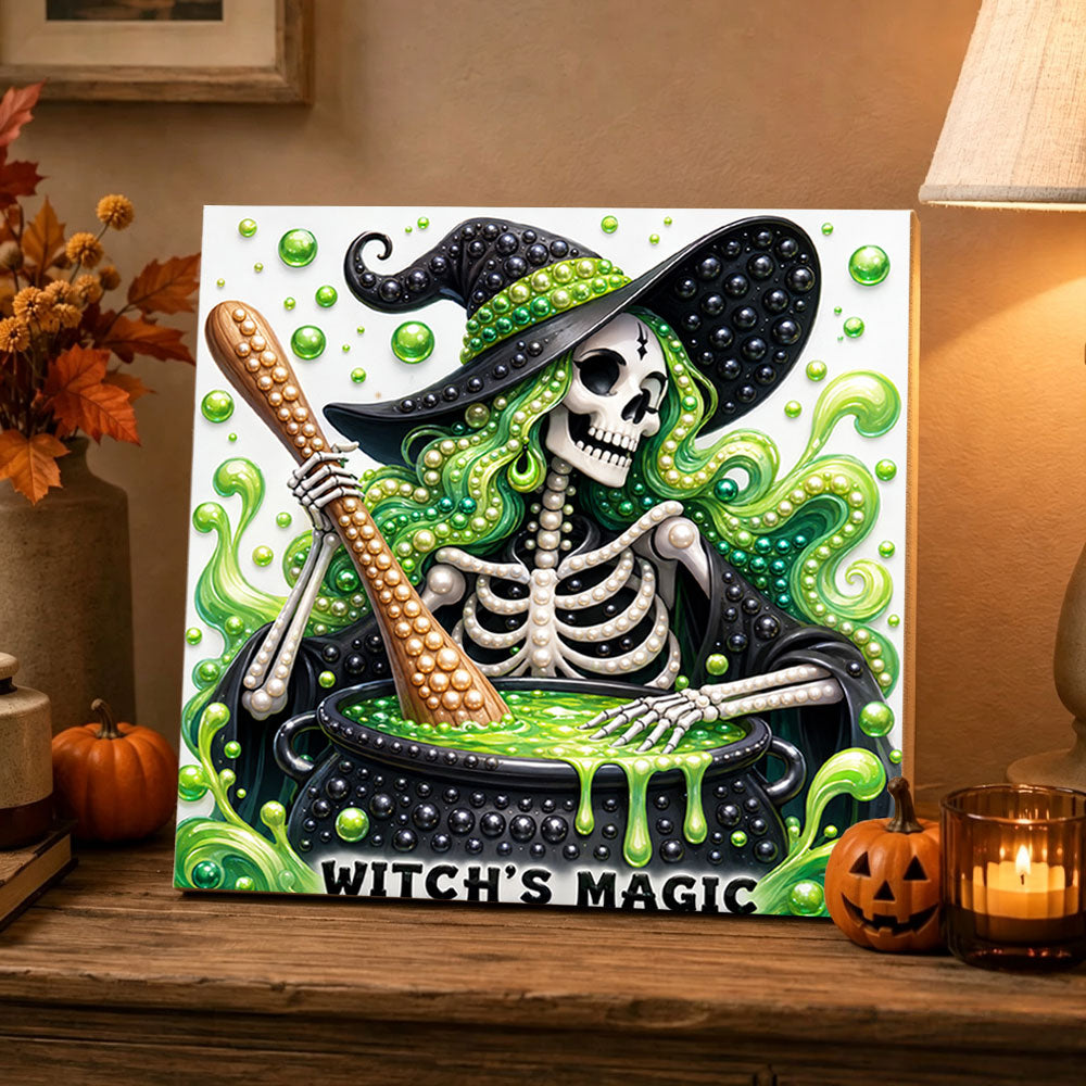 Finished skeleton witch brewing potion pearl diamond painting artwork displayed as holiday home decor