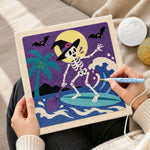 Creating handmade skeleton witch surfing waves punch needle artwork