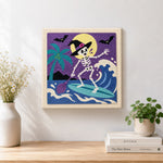 Finished skeleton witch surfing waves artwork displayed on a wall