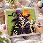 Creating handmade skeleton witch with cauldron punch needle artwork