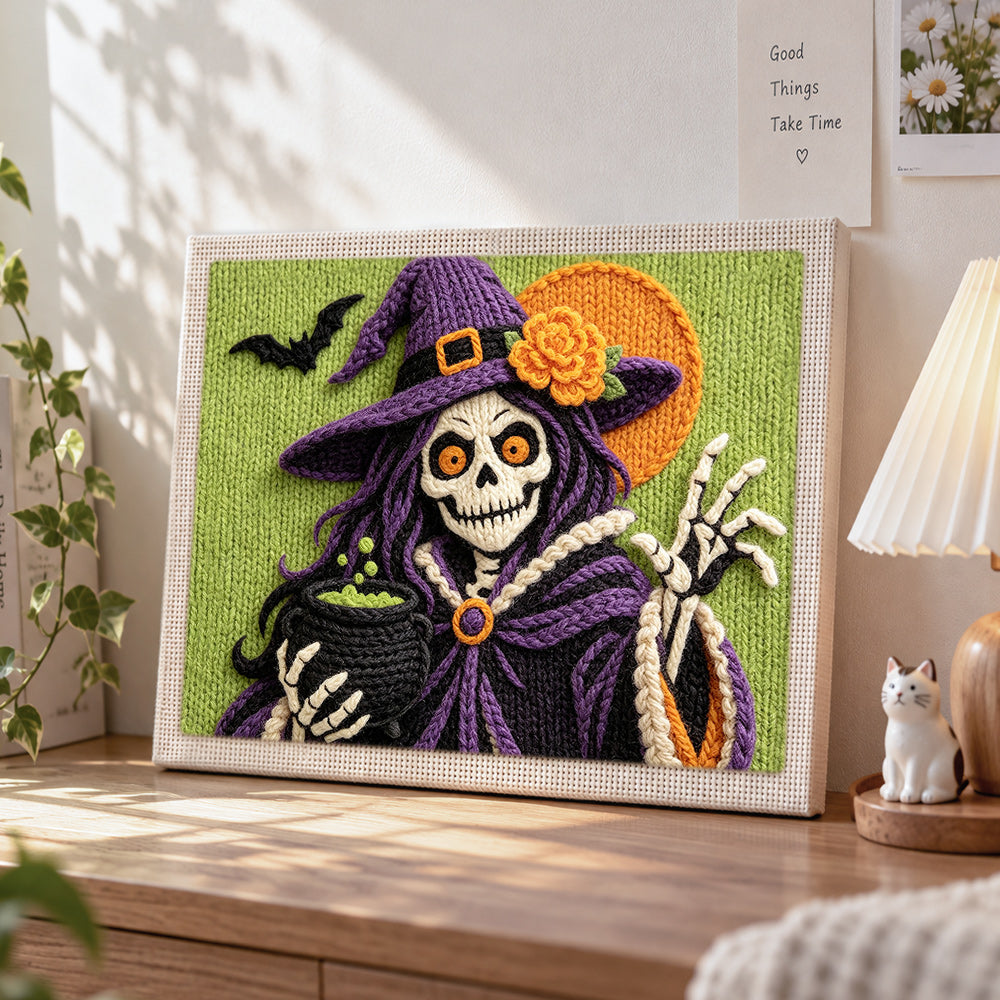 Skeleton witch with cauldron punch needle artwork displayed on a table