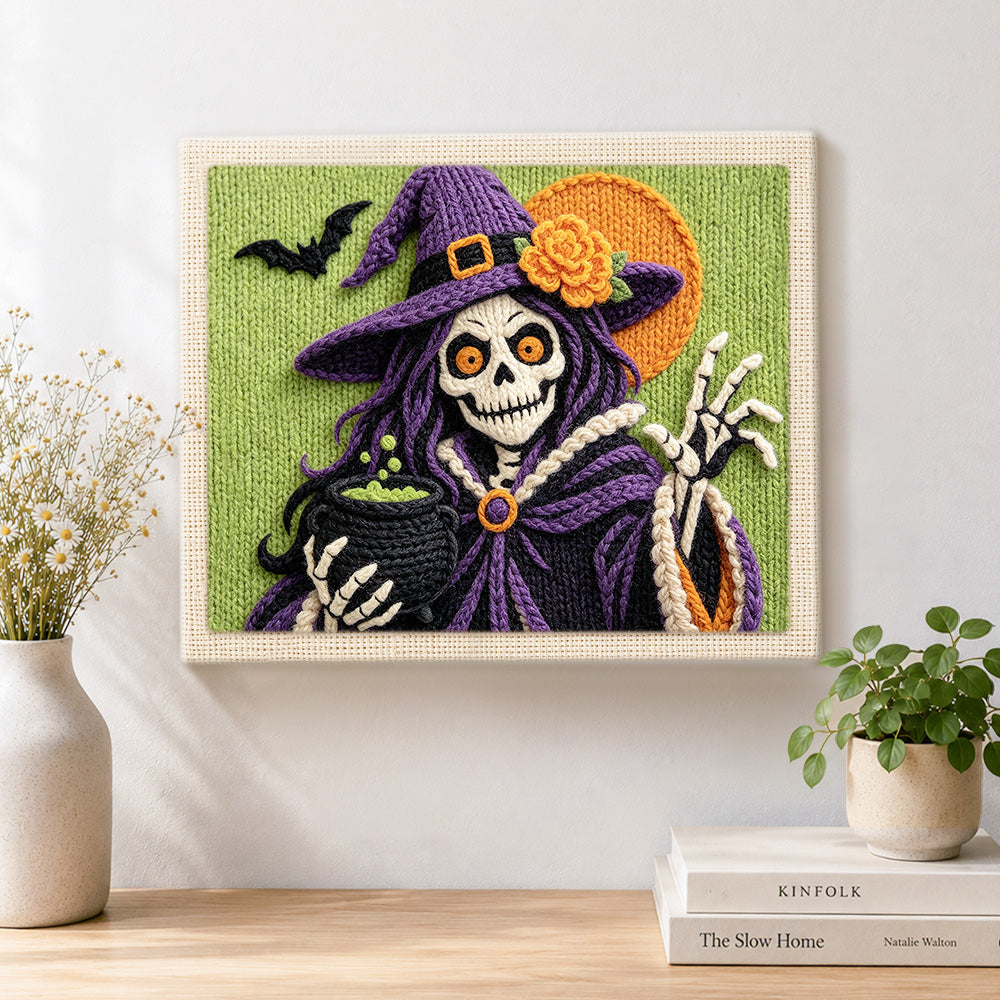 Finished skeleton witch with cauldron artwork displayed on a wall