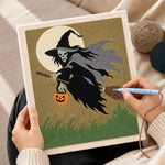 Creating handmade skeleton witch with pumpkin lantern punch needle artwork
