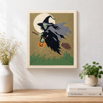 Finished skeleton witch with pumpkin lantern artwork displayed on a wall