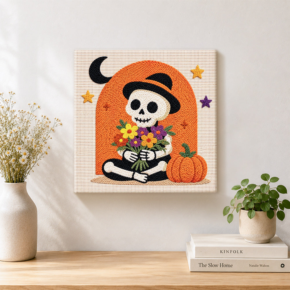 Skeleton with flower bouquet punch needle artwork displayed on a table
