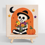 Finished skeleton with flower bouquet artwork displayed on a wall