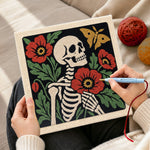 Creating handmade skeleton with poppies and butterfly punch needle artwork