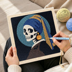 Creating handmade skeleton with pumpkin earring punch needle artwork