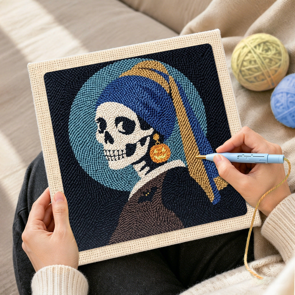 Creating handmade skeleton with pumpkin earring punch needle artwork