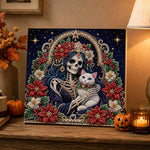 Finished skeleton with white cat and poinsettia pearl diamond painting artwork displayed as holiday home decor