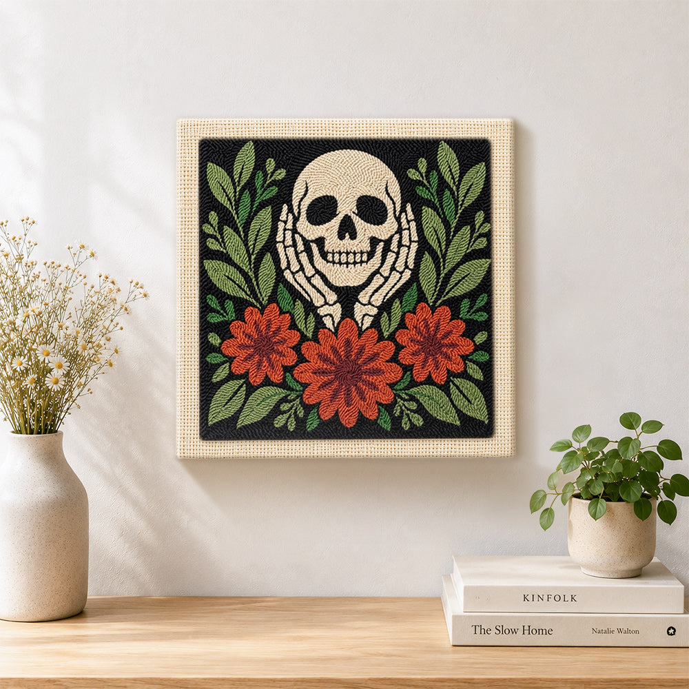Finished skull cupping cheeks with autumn blooms artwork displayed on a wall