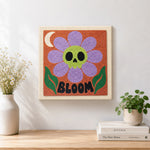 Finished skull flower bloom artwork displayed on a wall