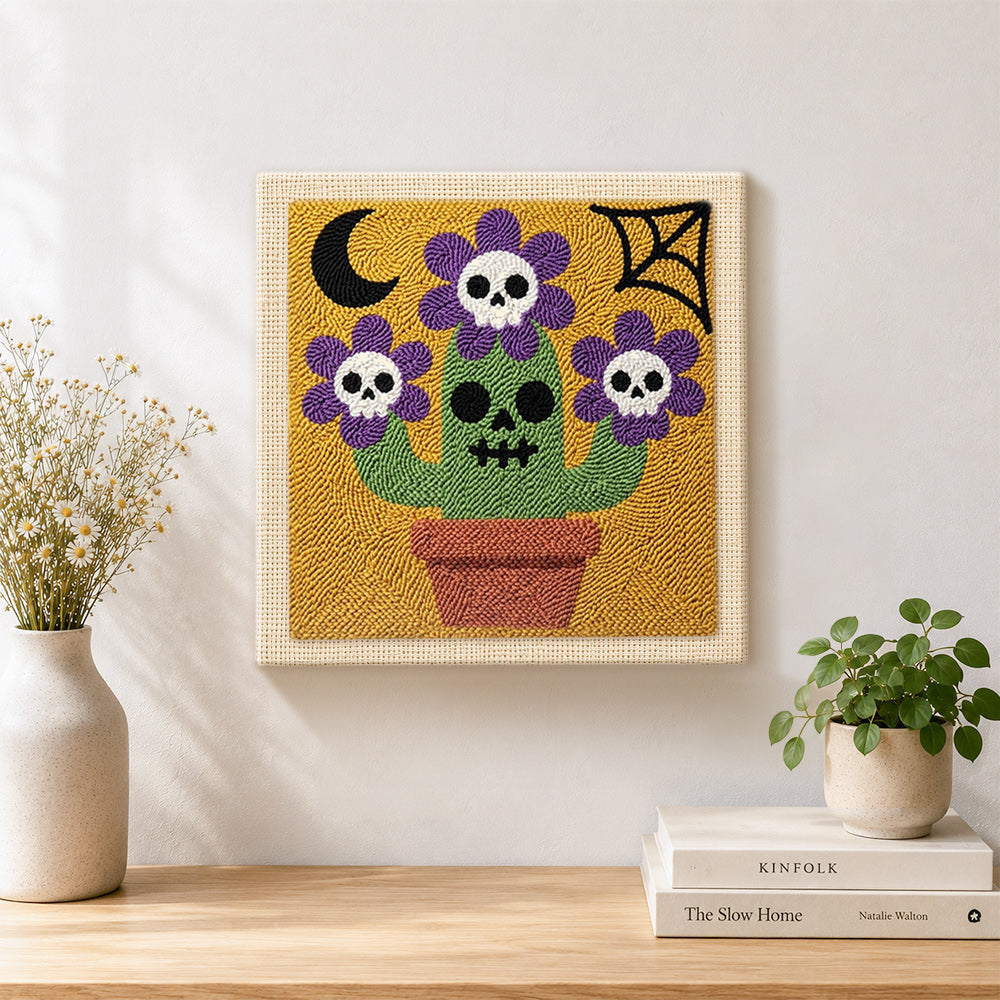 Finished skull flower cactus artwork displayed on a wall