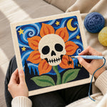 Creating handmade skull flower under starry sky punch needle artwork