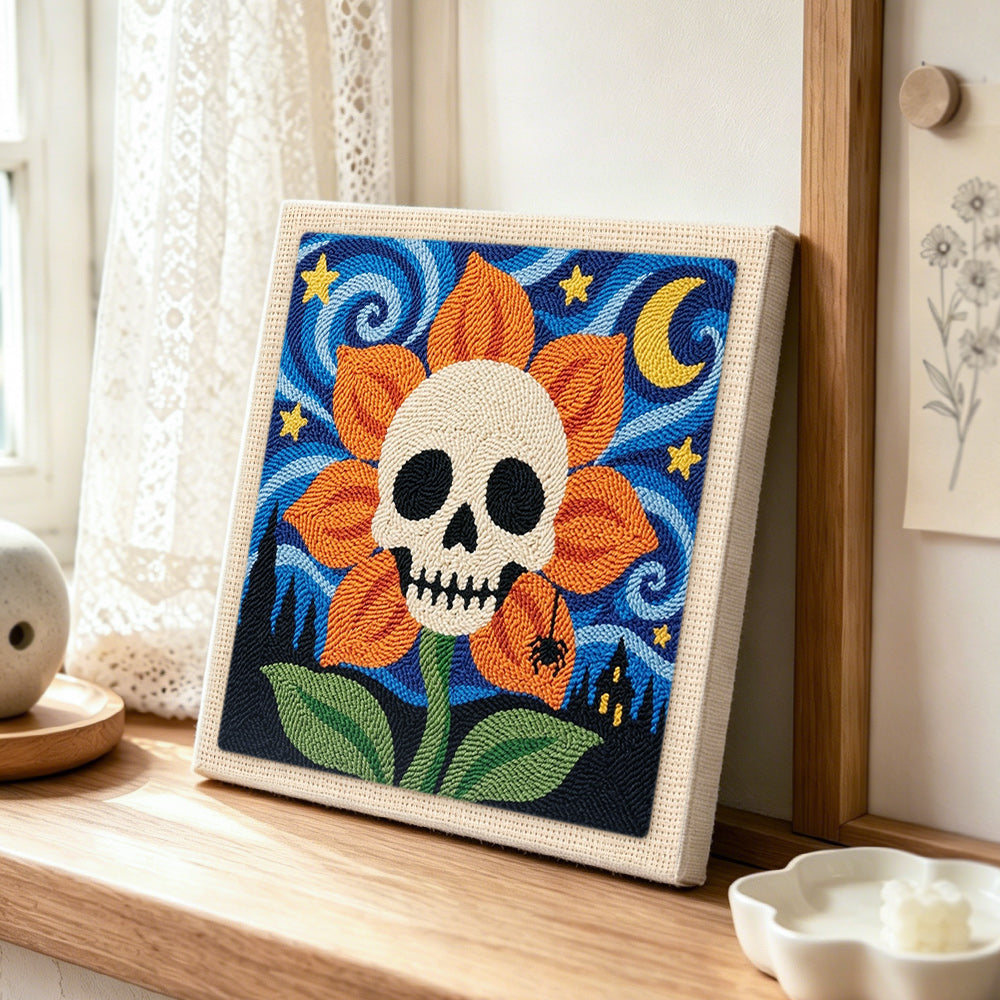 Skull flower under starry sky punch needle artwork displayed on a table