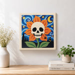Finished skull flower under starry sky artwork displayed on a wall