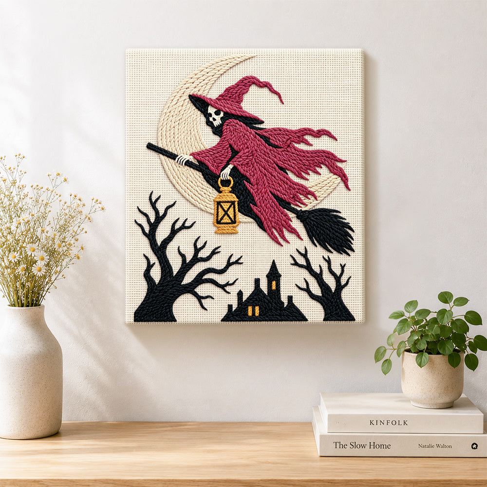 Finished skull witch on broom artwork displayed on a wall