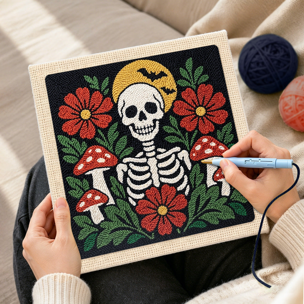 Creating handmade skull with flowers and mushrooms punch needle artwork