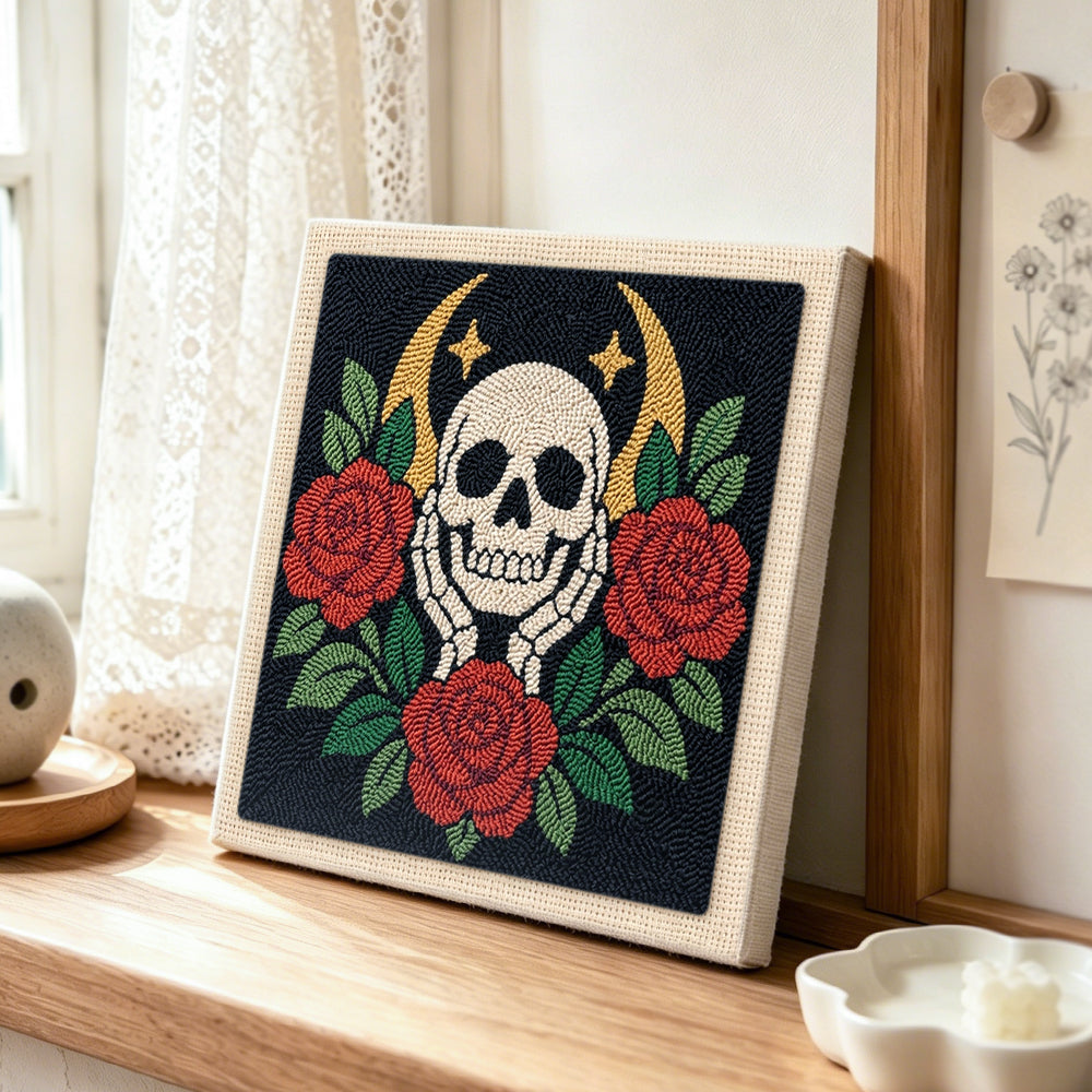 Skull with red roses punch needle artwork displayed on a table
