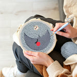 Creating handmade sleeping crescent moon and star punch needle artwork