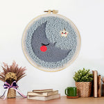 Finished sleeping crescent moon and star artwork displayed on a wall