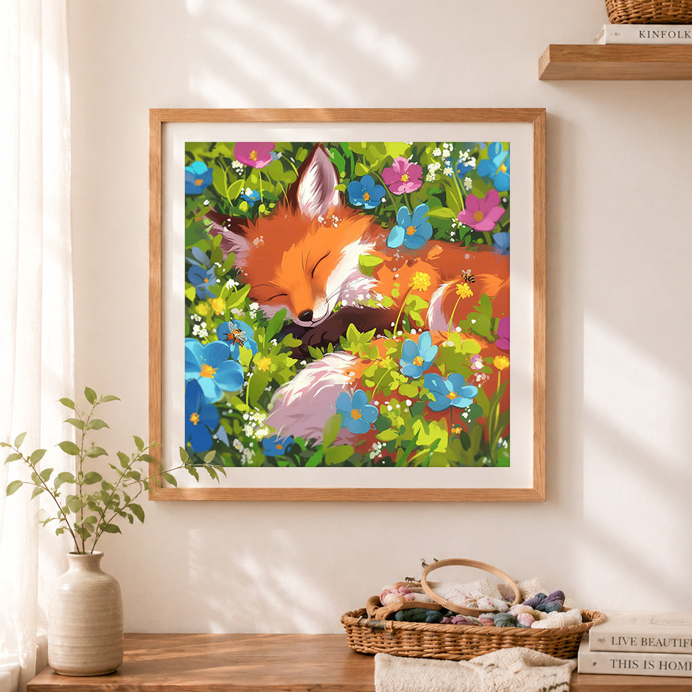 Finished sleeping fox wildflowers cross stitch artwork displayed as home decor