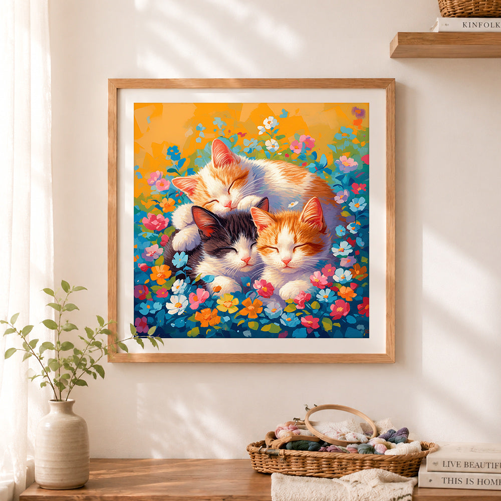 Finished sleeping kittens flowers cross stitch artwork displayed as home decor