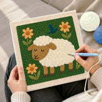 Creating handmade sleeping sheep with flowers punch needle artwork