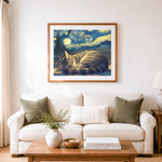 Finished sleeping tabby cat in starry night cross stitch artwork displayed as home decor