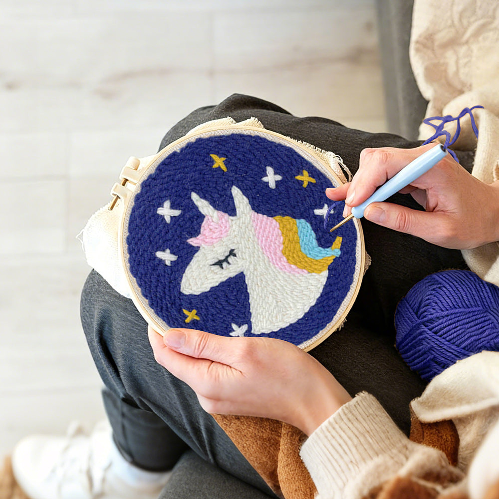 Creating handmade sleeping unicorn under stars punch needle artwork