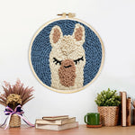Finished sleepy alpaca artwork displayed on a wall