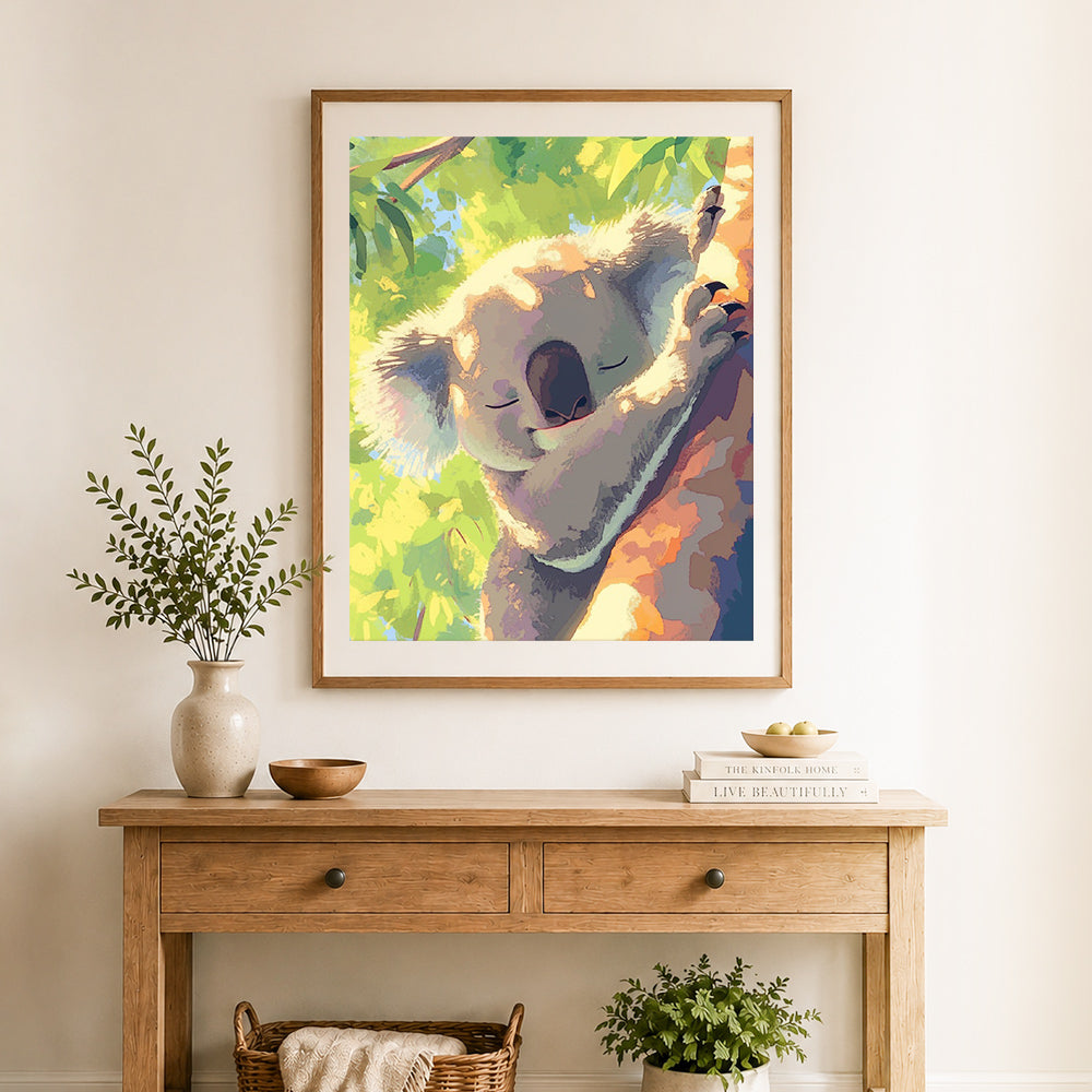 Finished sleepy cozy koala cross stitch artwork displayed as home decor