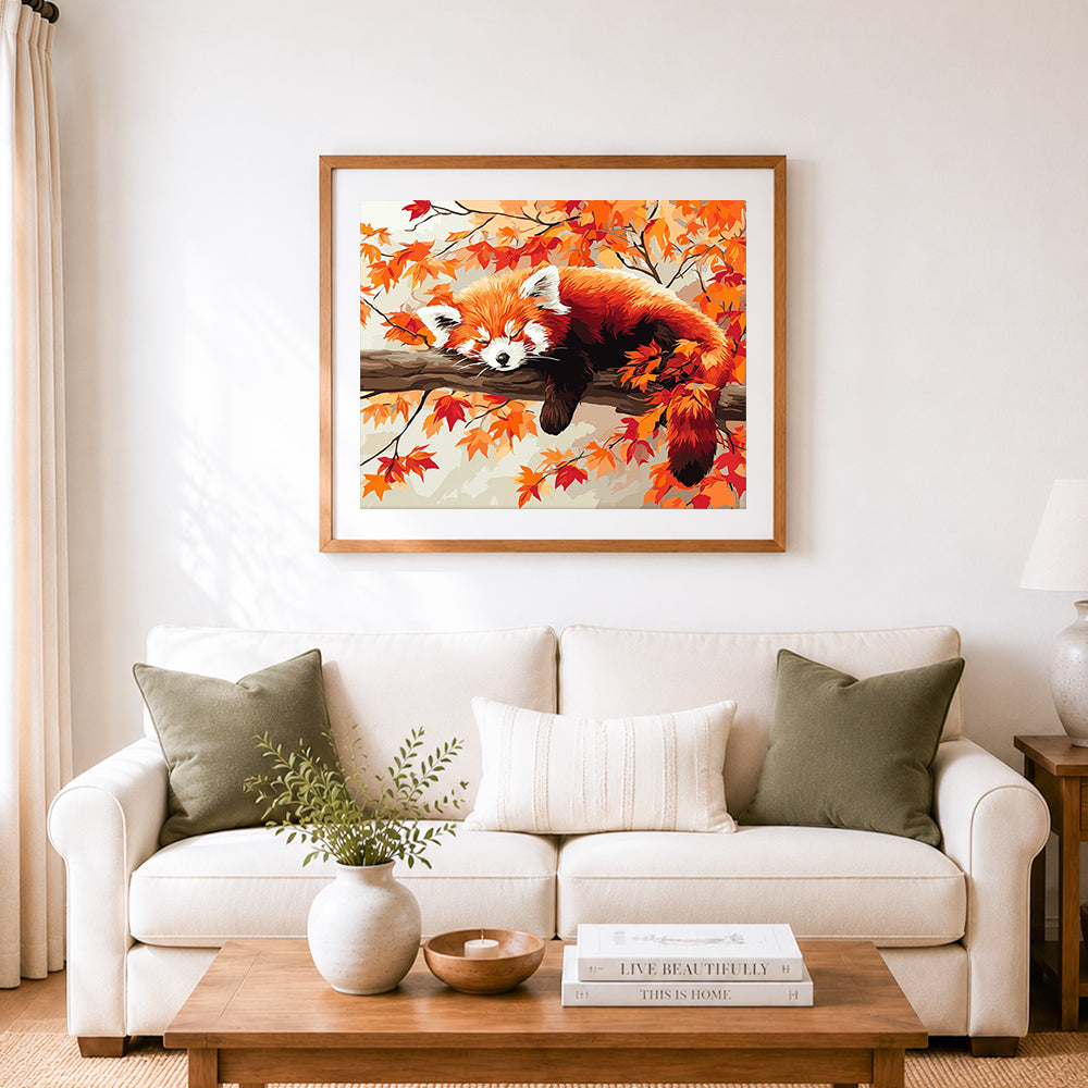 Finished sleepy red panda in autumn cross stitch artwork displayed as home decor
