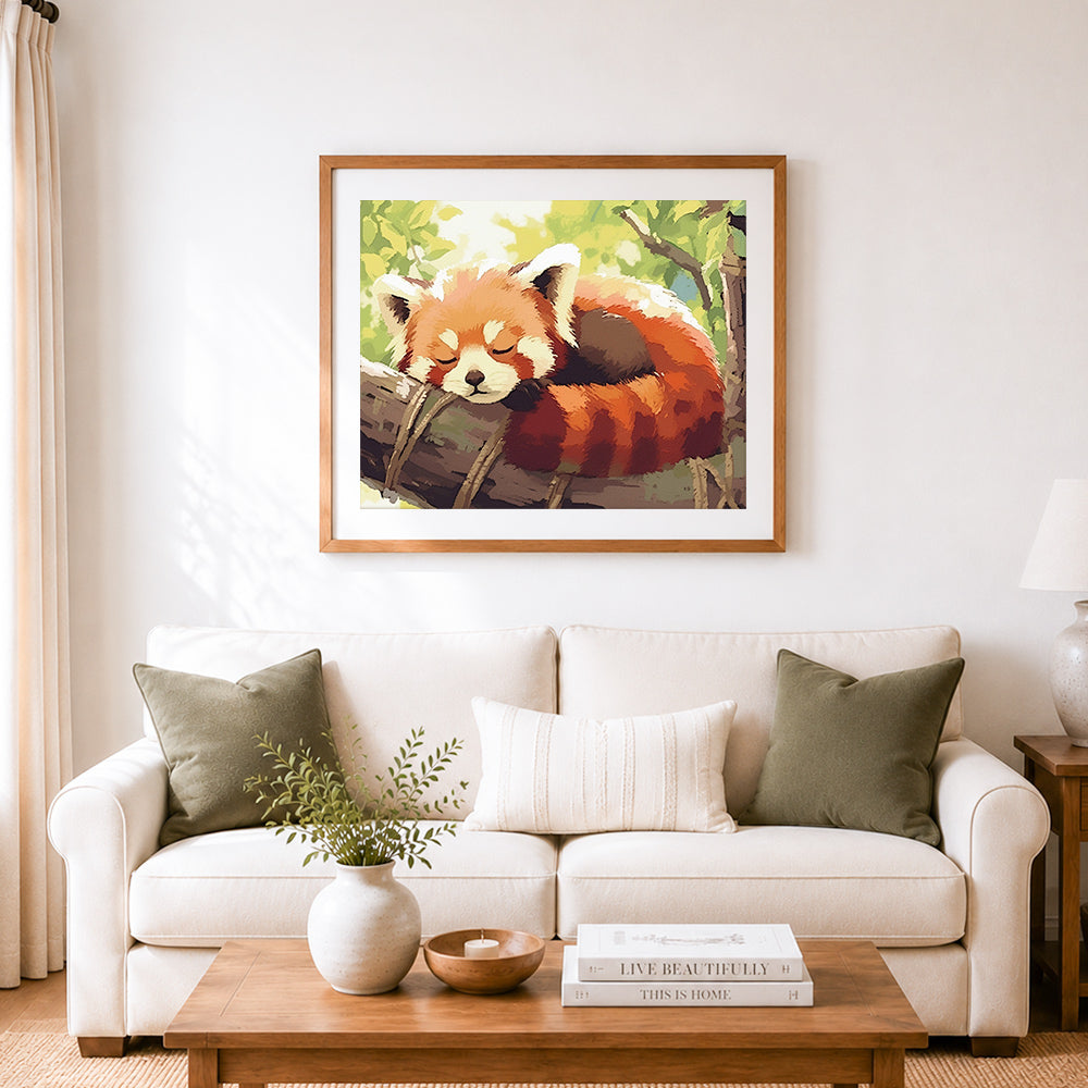 Finished sleepy red panda on tree log cross stitch artwork displayed as home decor