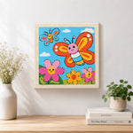 Finished smiling butterflies and flowers artwork displayed on a wall